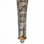 Solid pewter mezuzah inscribed with traditional Jewish blessing for home, featuring Hebrew text and decorative motifs, on a white studio background.