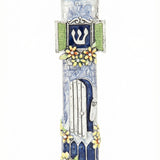 High-quality pewter mezuzah with hand-painted blue and white enamel, depicting a welcoming home with an open door and small mezuzah.