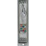 Detailed high-resolution image of a Hoshen mezuzah, showcasing intricate design, Hebrew engravings, in a bright white studio setting with reflection.