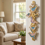 Hyper-realistic indoor doorway with the Shalom Birds Mezuzah mounted on the side, showcasing its gold, blue, pink, purple colors and detailed design.