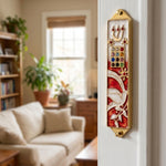 Hyper-realistic indoor lifestyle image of a doorway with a red enamel Dove Mezuzah mounted on the side, highlighting its colorful and symbolic design.