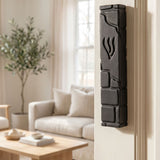 Hyper-realistic indoor doorway scene with black cement mezuzah mounted on the left side of the door frame, showcasing its details and placement.