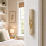 Real Jerusalem stone mezuzah with gold shin on right doorpost in entryway scene.