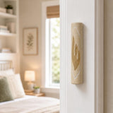 Real Jerusalem stone mezuzah with gold shin on right doorpost in entryway scene.