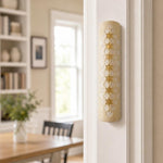 Real Jerusalem stone mezuzah mounted on a residential doorpost in a natural indoor setting, showcasing its handcrafted design and natural surface characteristics.