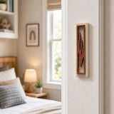Realistic indoor scene showing Jerusalem stone mezuzah mounted vertically on a doorpost at entryway, with interior room visible.