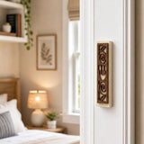 Realistic indoor scene showing Jerusalem stone mezuzah mounted on residential doorpost near entrance, positioned on right side at lower third.