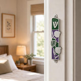 Hyper-realistic indoor scene showing the exact mezuzah mounted vertically on a residential doorpost near the entrance.
