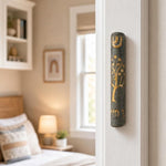 Real Jerusalem stone Tree of Life Gray mezuzah mounted vertically on a doorpost in an indoor setting, positioned on the right side of the doorway.
