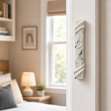 Realistic indoor scene showing the stone-like mezuzah mounted on a residential doorpost near the entrance, in true-to-life scale.