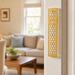 Realistic indoor scene showing a golden star of david acrylic mezuzah mounted on a doorway post.