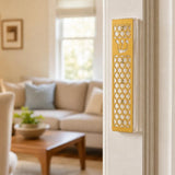 Realistic indoor scene showing a golden star of david acrylic mezuzah mounted on a doorway post.