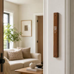 Mahogany wood mezuzah mounted on the right side of an indoor doorpost.