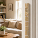Nine-inch plain stone mezuzah mounted vertically on a residential doorpost.