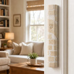 Nine-inch Kotel Jerusalem stone mezuzah on the right doorpost of a residential entrance at true scale.