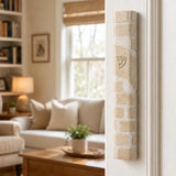 Nine-inch Kotel Jerusalem stone mezuzah on the right doorpost of a residential entrance at true scale.