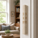 Birkat HaBayit cream stone mezuzah mounted on the right doorpost of a residential door.
