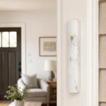 Residential door with white marble outdoor aluminum mezuzah mounted on the right doorpost, showing realistic scale.