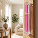 Stylish interior room with a doorway featuring a mounted pink Lucite Mezuzah, blended into a modern home decor setting.