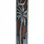 Jericho Mezuzah featuring a pewter date palm tree on a dark wood background, with precise details and inscriptions, on a white studio surface.