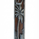 Jericho Mezuzah featuring a pewter date palm tree on a dark wood background, with precise details and inscriptions, on a white studio surface.