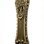 High-resolution image of an authentic brass Jerusalem Mezuzah, measuring 5.5 inches tall with detailed Hebrew engravings and decorative motifs, displayed on a white studio surface with soft reflection.