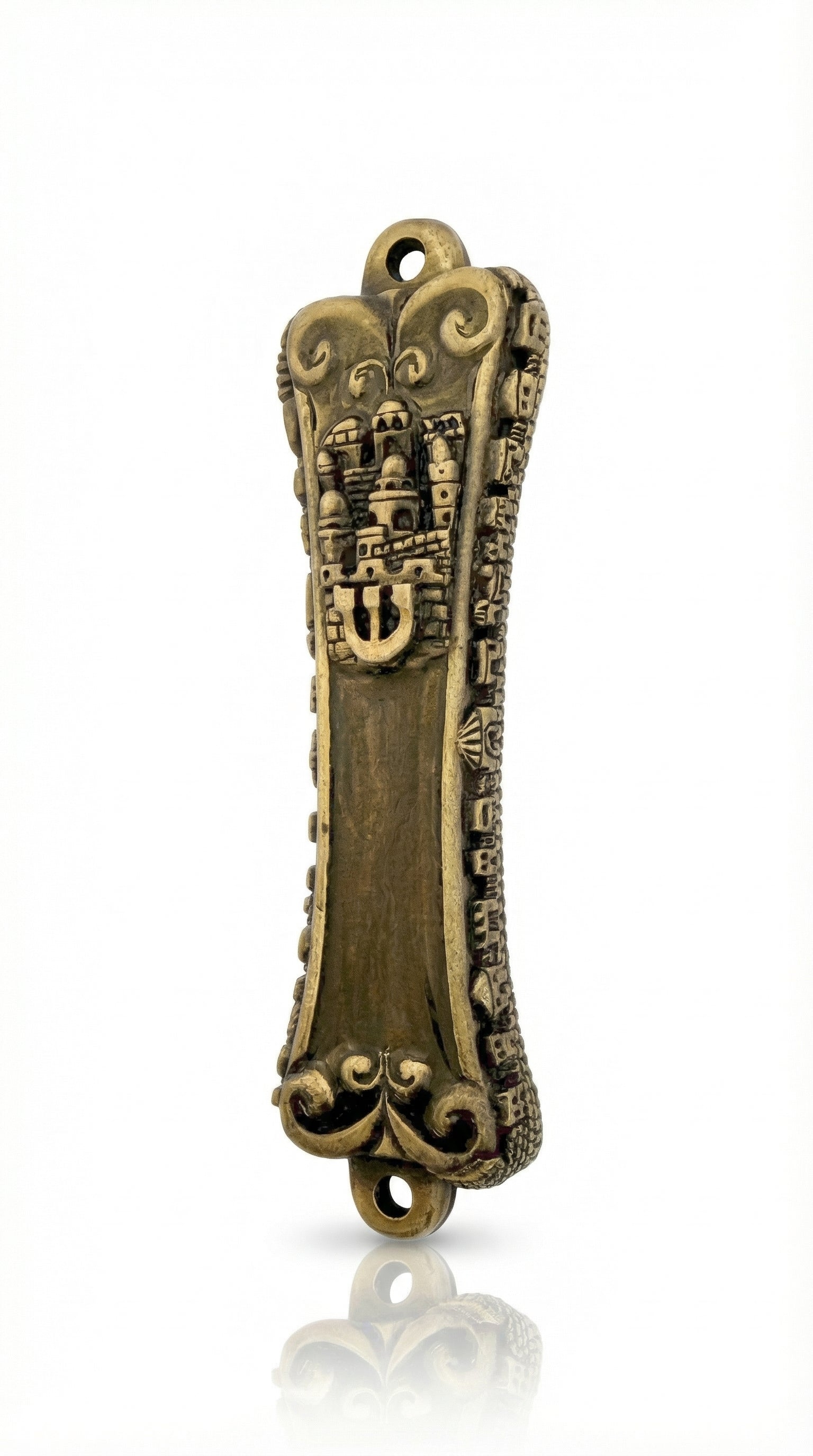 High-resolution image of an authentic brass Jerusalem Mezuzah, measuring 5.5 inches tall with detailed Hebrew engravings and decorative motifs, displayed on a white studio surface with soft reflection.