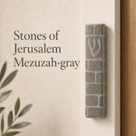 Gray Jerusalem stone mezuzah handcrafted in Israel, suitable for indoor and outdoor use, with traditional Hebrew symbols and natural surface texture.