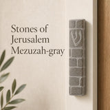Gray Jerusalem stone mezuzah handcrafted in Israel, suitable for indoor and outdoor use, with traditional Hebrew symbols and natural surface texture.