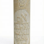 High-resolution image of a handcrafted Jerusalem stone mezuzah with Hebrew inscription, on a pure white background with soft reflection, showcasing intricate details and natural stone texture.