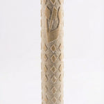 High-resolution image of a handcrafted Jerusalem Stone mezuzah with detailed texture, engraved Hebrew words, and decorative motifs, on a white studio background with a subtle reflection.