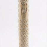 High-resolution image of a handcrafted Jerusalem Stone mezuzah with detailed texture, engraved Hebrew words, and decorative motifs, on a white studio background with a subtle reflection.