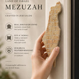 Eretz Yisrael kosher stone mezuzah mounted on a doorpost for indoor or outdoor use.