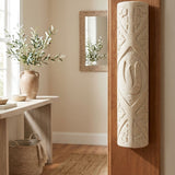 Handcrafted Jerusalem Stone mezuzah mounted on a doorframe in an indoor home setting, showcasing natural variations and traditional design.