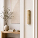 Jerusalem stone wedding mezuzah mounted on a residential doorpost, featuring traditional Hebrew engraving and gold detail.