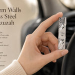 Jerusalem Walls Stainless Steel Car Mezuzah, a silver Israeli travel Judaica piece featuring raised Old City of Jerusalem wall relief, a polished diagonal band, and a raised Shin for Shaddai