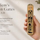 Peach enamel Jerusalem mezuzah with gold accents, Hebrew Shin, Star of David, Jerusalem architecture, in a holder.