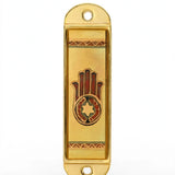 Journey Hamsa Gold Car Mezuzah shown from the front as a mezuzah cover featuring a brown Hamsa hand with a Star of David in its palm, warm gold-colored panels and patterned borders inside a rounded stainless-steel frame, presenting a small decorative Judaica design for a car interior