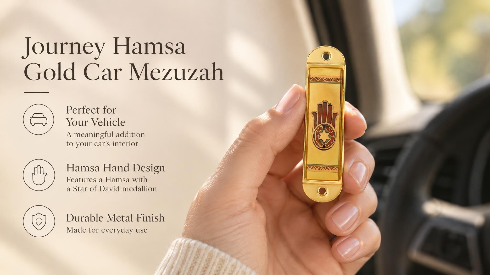 Journey Hamsa Gold Car Mezuzah mezuzah cover held upright in one hand, showing a brown Hamsa hand with a Star of David in its palm, warm gold-colored panels and patterned borders inside a rounded stainless-steel frame beside the product name and illustrated design features in a wide social-sharing graphic for decorative Jewish travel Judaica