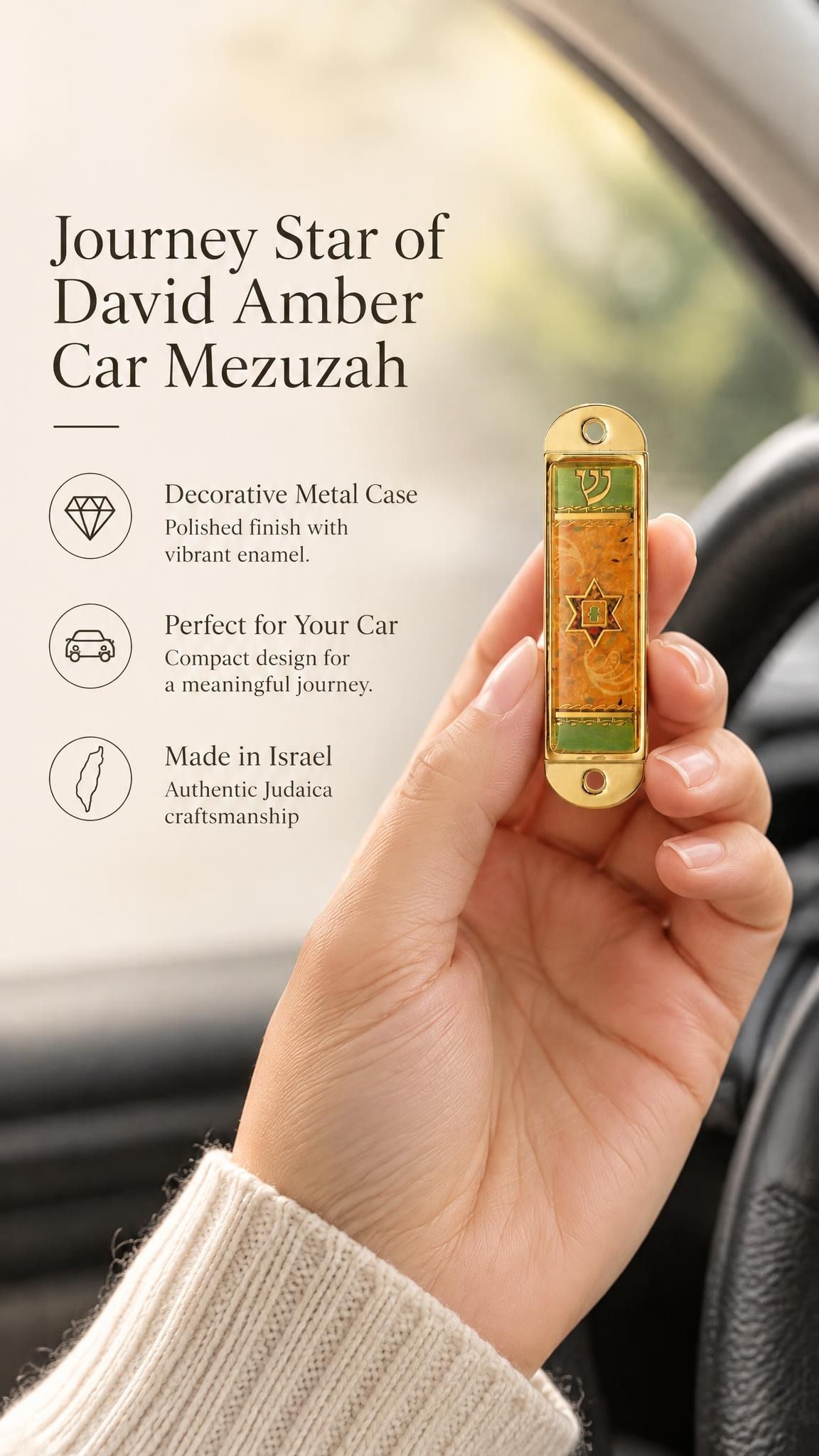 Hand holding the Journey Star of David Amber Car Mezuzah mezuzah cover inside a vehicle, showing an amber orange Star of David panel, muted green bands and a small Hebrew Shin within a gold-colored metal frame beside the product name and illustrated features for this decorative Jewish travel Judaica piece