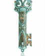 Ornate brown enamel pewter mezuzah in key shape, displayed on a white studio background with soft reflection, detailed craftsmanship.