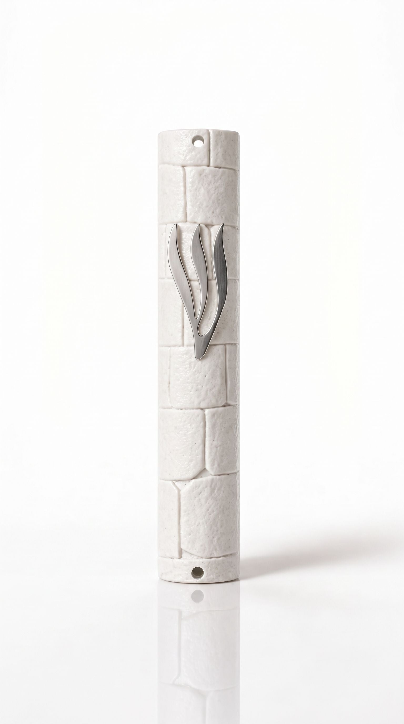 Kotel Stonework White Silver Shin Mezuzah shown from the front as a mezuzah cover featuring an opaque white plastic body with molded stone-block texture, a long silver-colored Hebrew Shin and visible top and bottom mounting holes, presenting a detailed Judaica design for a Jewish home doorway