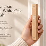 Large Classic Natural White Oak Wooden Mezuzah case held beside an entrance with pale honey colored grain and a white outline Shin, accompanied by product text highlighting natural oak and Jewish home and office doorways