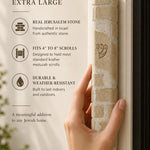 Kotel cream Jerusalem stone mezuzah mounted on a doorpost, showing natural veining across the coursed stone face.
