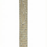 Extra large Jerusalem stone Mezuzah mounted with strong tape in a bright studio setting, detailed surface texture and engraved Hebrew lettering visible.
