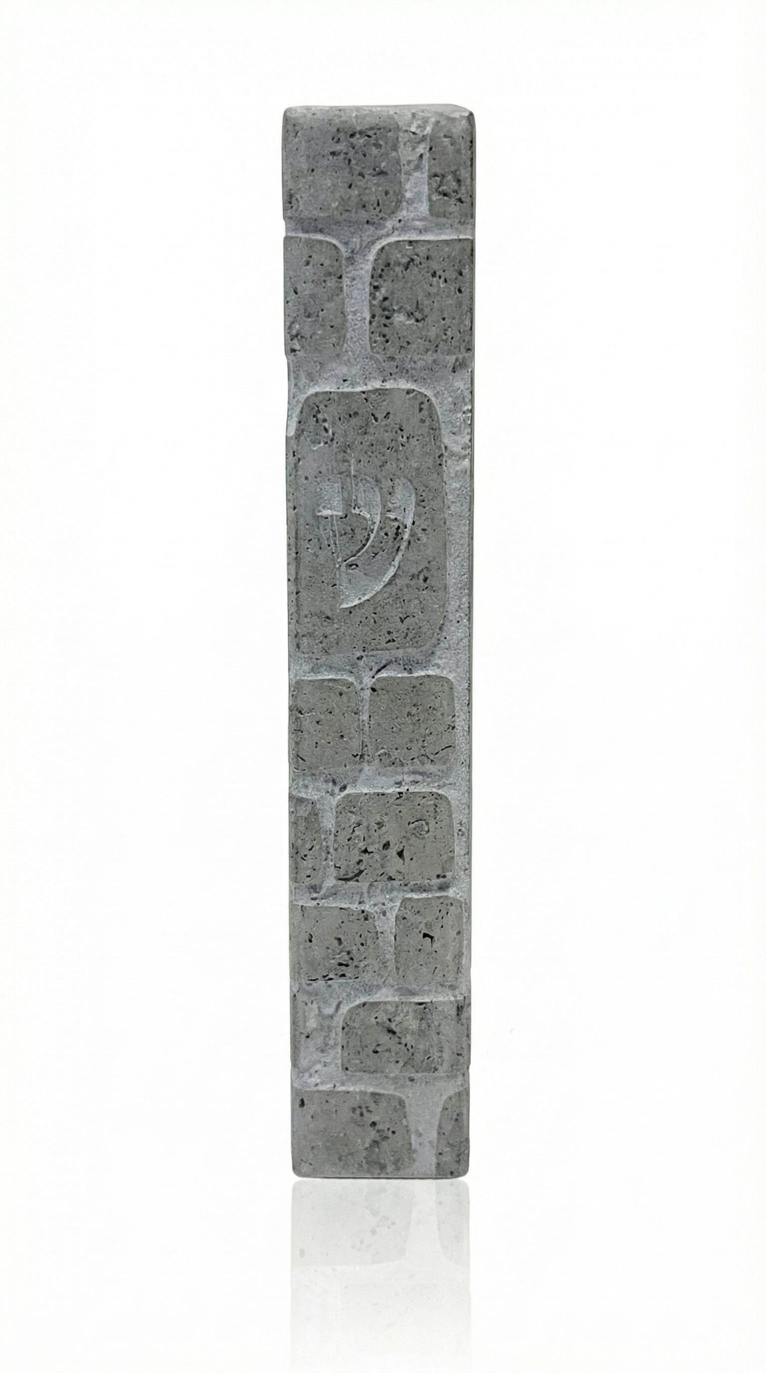 Large gray Mezuzah modeled after the Kotel, handcrafted from natural Jerusalem stone with detailed engravings and decorative motifs, on a white background with soft reflection.