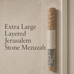 Extra large layered Jerusalem stone mezuzah displayed on a plain background, emphasizing its sculptural design and natural earth tones.