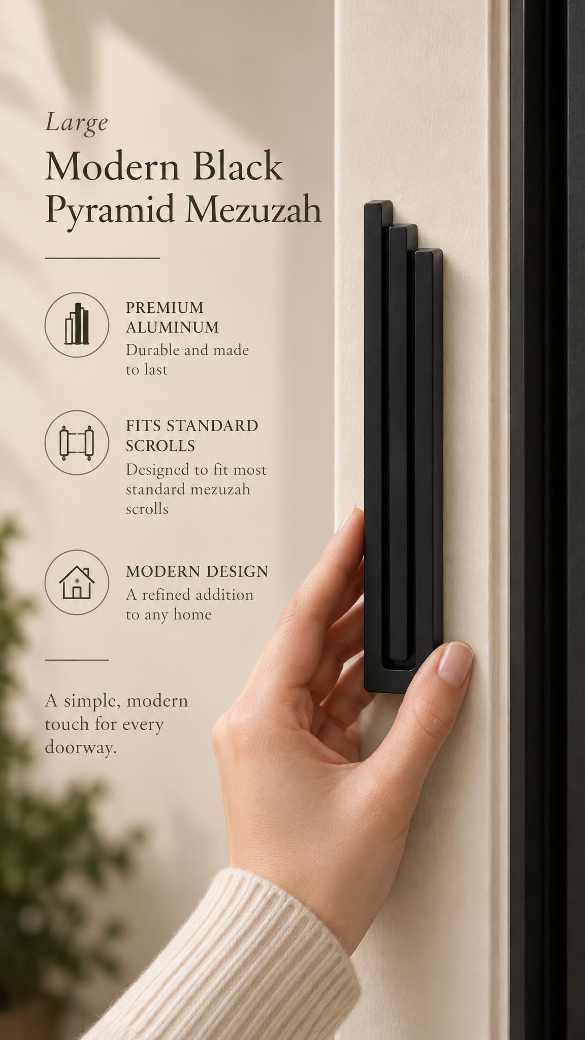 Large Modern Black Pyramid Mezuzah held beside a doorpost, with the deep matte black aluminum mezuzah cover shown close enough to reveal its three stepped bars and rounded lower edge alongside product-name and design callouts for this contemporary Judaica piece