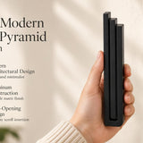 Large Modern Black Pyramid Mezuzah pictured in hand as a deep matte black aluminum mezuzah cover with three graduated bars and a contemporary stepped design, alongside its name and illustrated product features in a wide social-sharing image