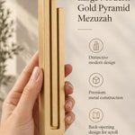 Hand holding the Large Modern Gold Pyramid Mezuzah upright, revealing its warm metallic gold aluminum mezuzah cover, slender three-bar Pyramid design and graduated top beside illustrated product features for contemporary Jewish home Judaica